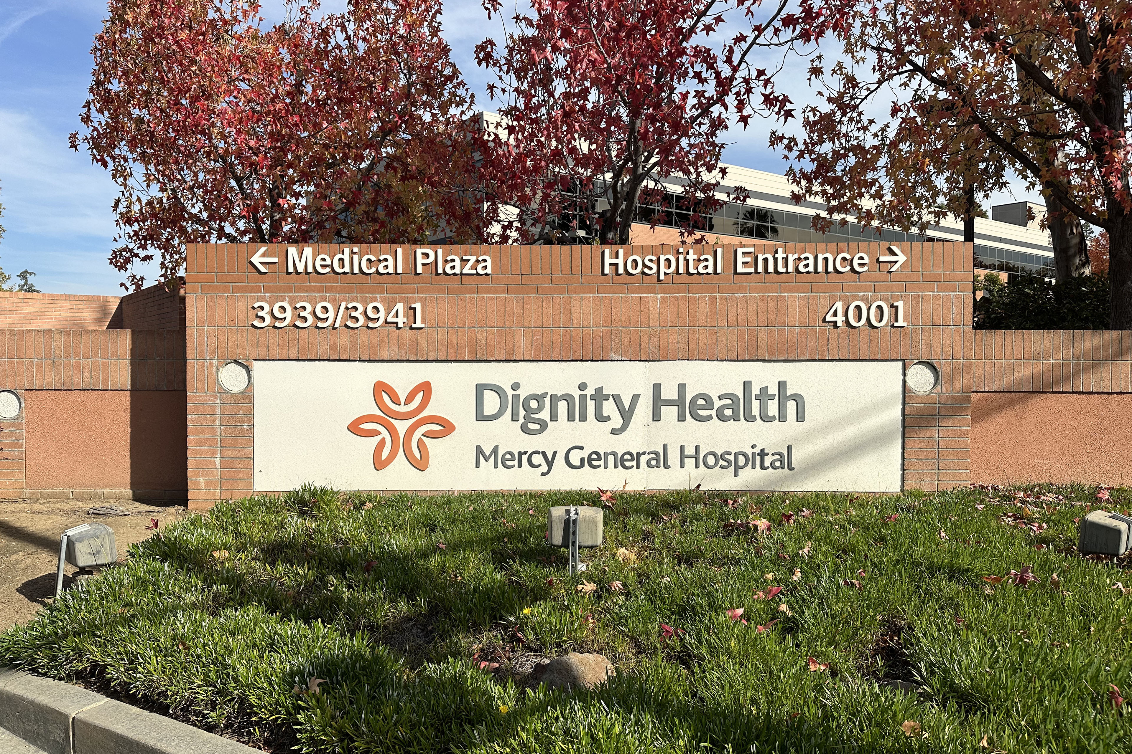 A photo showing the brick entryway sign for Mercy General Hospital, which is run by Dignity Health.