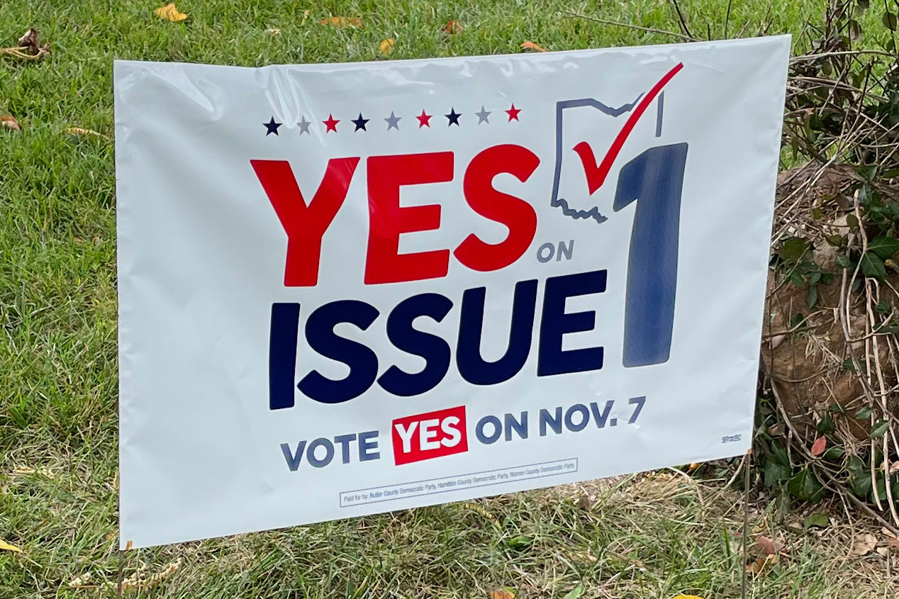A photo of sign that reads, "Yes on Issue 1. Vote yes on November 7."