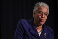 A photo of Toni Preckwinkle speaking at an event.