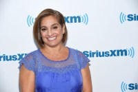 A photo of Mary Lou Retton posing for a photo outside of SiriusXM's studios.